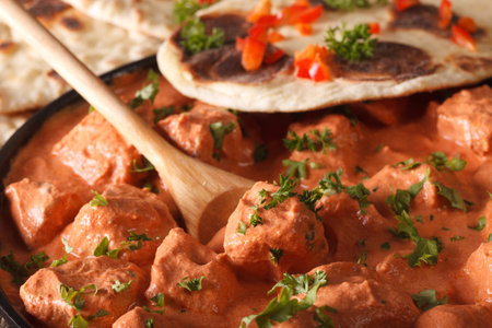 Indian food chicken tikka masala macro on a plate.の写真素材