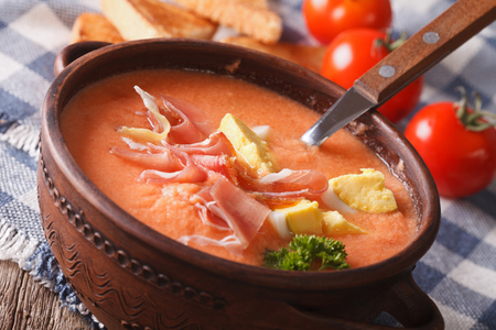 delicious soup salmorejo with ham and eggs close-up in a bowl. horizontalの写真素材