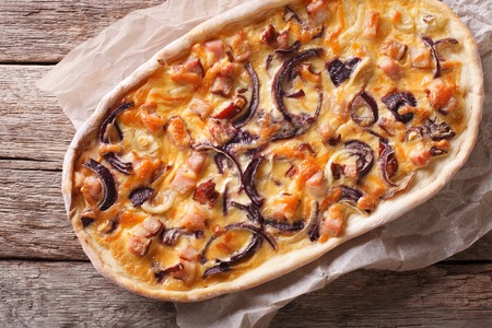 flammkuchen close-up on a paper on the table. Horizontal  top viewの写真素材
