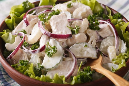 Chicken salad with celery and cucumber in a bowl close-up. horizontalの写真素材