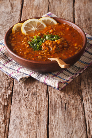 Thick Moroccan Harira soup in a bowl on the table. verticalの写真素材