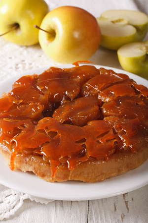Tarte Tatin with apples and caramel close up on a plate on the table. verticalの写真素材