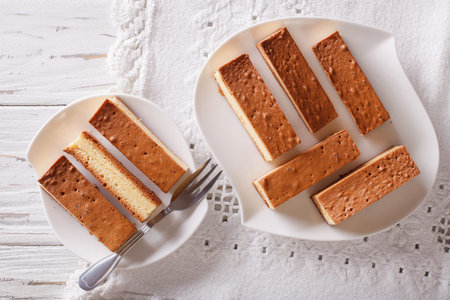 Japanese cake kasutera close-up on a plate on the table. Horizontal view from above