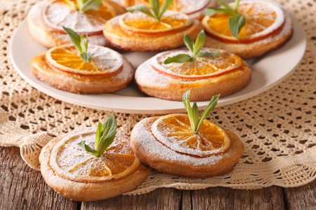 Homemade cookies with almonds and oranges closeup on a plate. horizontalの写真素材