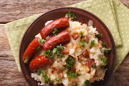 stamppot mashed potatoes, cabbage and carrots, with sausages close-up on a plate. horizontal view from aboveの写真素材