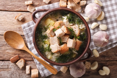 "Delicious garlic soup with croutons close-up on the table. horizontal view from above
"
の写真素材