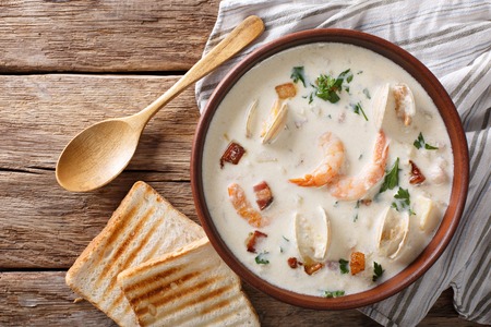 American cuisine: New England clam chowder soup closeup on the table. Horizontal view from aboveの写真素材