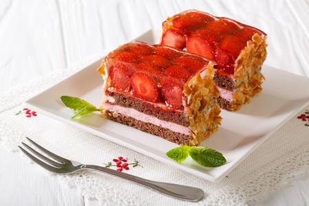 Beautiful strawberry jelly cake with almonds close-up on a plate. horizontalの写真素材
