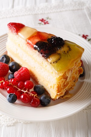 Delicious Slice of fruit berry cake close-up on a plate. Verticalの写真素材