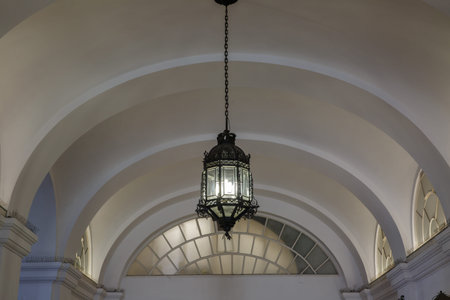 An ancient ceiling lamp in the Hofburg Palace in Vienna. Austria