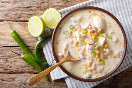 White chili chicken with beans, corn and spices close-up in a bowl. horizontal top view from aboveの写真素材