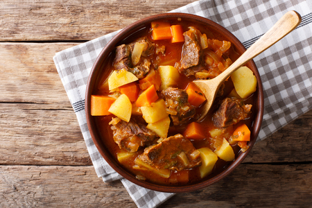delicious stew estofado with beef and vegetables in a bowl close-up. Horizontal top view from above
の写真素材