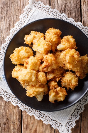fried cauliflower in breading close-up on a plate. Vertical top view from above
の写真素材