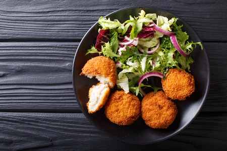 Healthy Eating: Fish cod cake and fresh salad close-up on a plate on the table. horizontal top view from aboveの写真素材