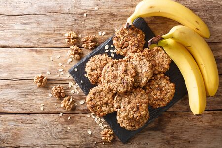 banana cookies with ingredients close-up on a slate board on the table.の写真素材