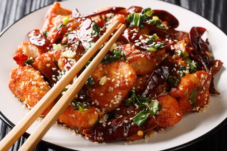 Very spicy Sichuan mala chicken is a popular dish in China close-up in a plate on the table. Horizontal
の写真素材