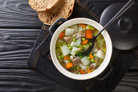 Hairst Bree Harvest Broth traditional Scottish recipe for a classic hearty broth of lamb meat mixed summer vegetables. Horizontal top view from aboveの写真素材