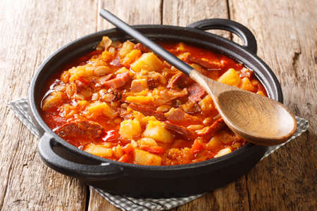 Delicious organic Locro cooked vegetables, sausages and meat close up in a pot on the table. horizontalの写真素材