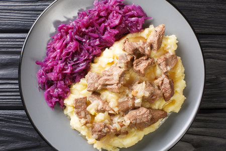 Hachee based on beef, onions, potatoes, red cabbage is a typical example of traditional Dutch cuisine closeup in the plate on the table. horizontal top view from aboveの写真素材