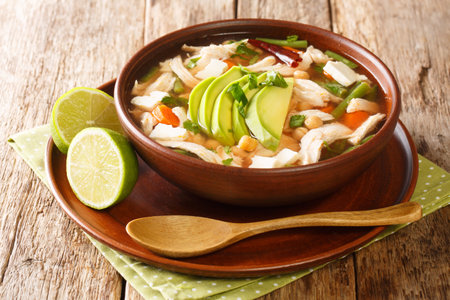 Caldo Tlalpeno Chicken and Vegetable Soup closeup in a bowl on the table. horizontalの写真素材