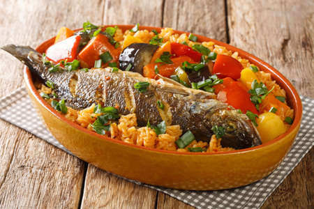 Senegalese rice and fish with vegetables Thieboudienne closeup in the dish on the table. horizontalの写真素材