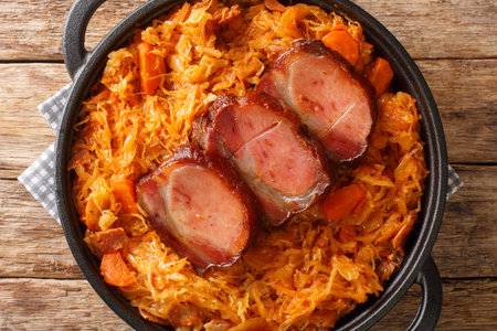 Podvarak Traditional Dish from Balkan Sauerkraut with smoked pork and bacon closeup in the pan on the table. horizontal top view from aboveの写真素材
