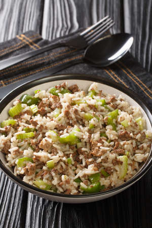 Dirty rice is a classic Cajun dish that is typically made with chicken livers and ground meat close-up in a plate on the table. Verticalの写真素材