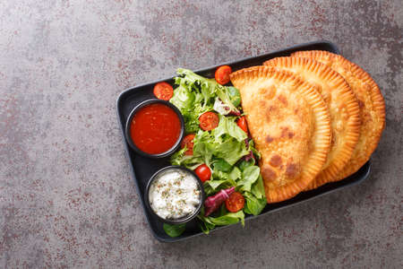 Traditional Chebureki with meat close-up on the table. horizontal top view from aboveの写真素材