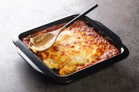 Portuguese casserole Bacalhau espiritual delicious cod cooked with onion, grated carrots sprinkled...