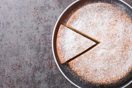 Easy Yogurt Cake, a simple easy and delicious Snack or Dessert Cake closeup in a plate on a table....