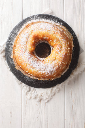 Homemade Bundt cake Italian Ciambella closeup on the table. Vertical top view from aboveの写真素材