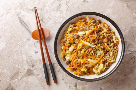 Egg roll bowl it is a meal combines ground pork, shredded cabbage, and our favorite eggroll closeup on the table. Horizontal top view from aboveの写真素材
