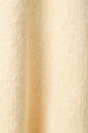 Closeup detail of beige fabric texture background. Macro photography.の素材