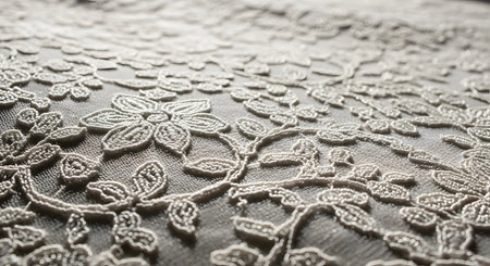 macro texture of lace fabric with floral pattern, can be used as backgroundの素材