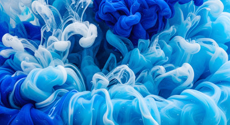 abstract background of blue and white acrylic paint in water close upの素材