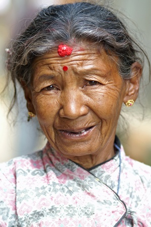 Nepal, Kathmandu Valley, october 10, 2010. Old woman protrait in national clothes on the street of Kathmanduのeditorial素材