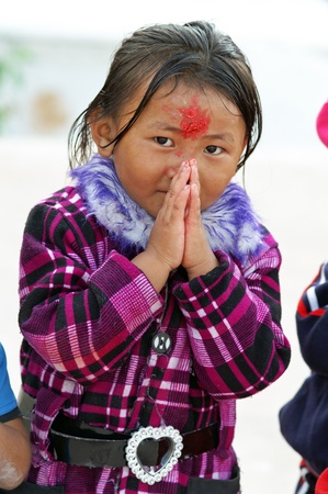 Nepal, Kathmandu Valley, october 11, 2010. Baby protrait in national clothes on the street of old townのeditorial素材