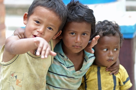 Kathmandu, Nepal, october 11, 2010: three children playing on the streetのeditorial素材