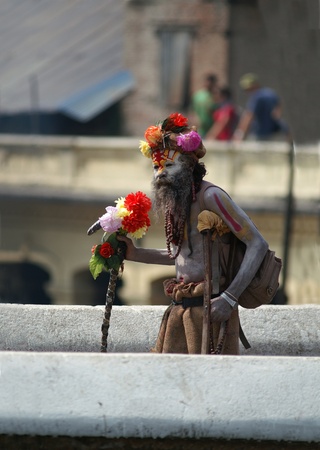 Kathmandu, Nepal, october 11, 2010: sadhu (holy man) walking on the bridgeのeditorial素材