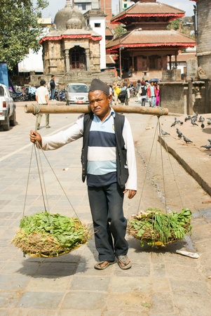 Kathmandu, Nepal - October 10, 2010: porterman walking on the streetのeditorial素材