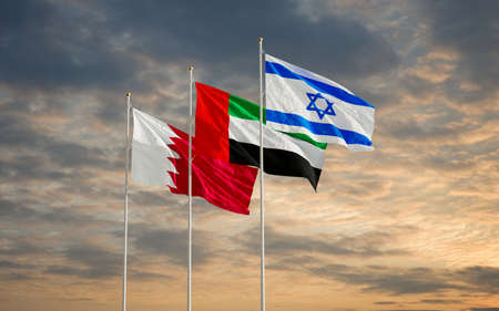 Bahrain UAE Israel flags waving against a cloudy sky background. Bahrain Israel United Arab Emirates signing historic diplomatic deal. Jerusalem Manama Abu Dhabi relations 2020. 3D renderingの写真素材