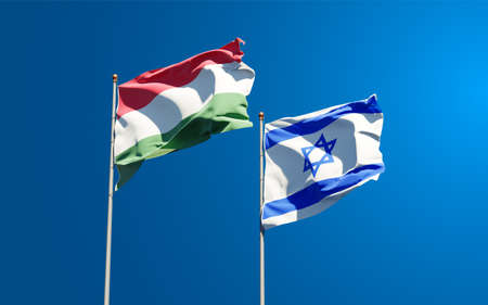 Beautiful national state flags of Hungary and Israel together at the sky background. 3D artwork concept.の写真素材