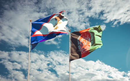 Beautiful national state flags of Afghanistan and American Samoa together at the sky background. 3D artwork concept.の写真素材