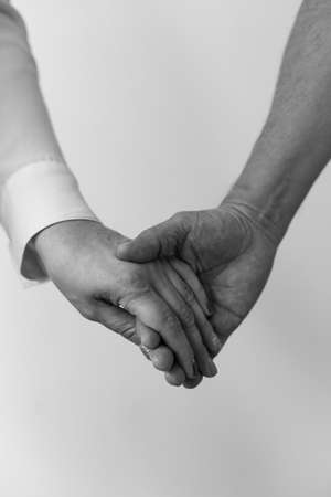 Detail Of The Hands Of A Couple. Black And White. Verticalの写真素材