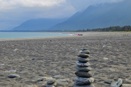 Beautiful scenic of ocean with stone covered beach at Manbo beach, Hualien Taiwanの写真素材