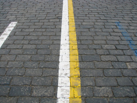 Stone blocks with color lines of a road marking