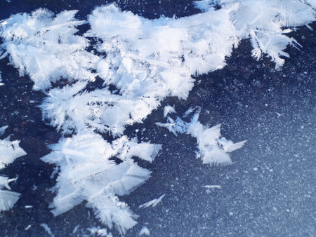 Snow pattern on the ice of the frozen river