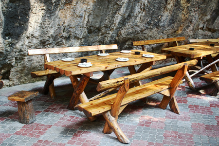 Wooden tables and benches in the outdoor cafeの写真素材