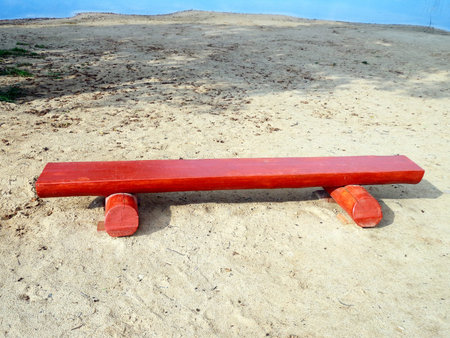 Wooden bench on the sandy beach