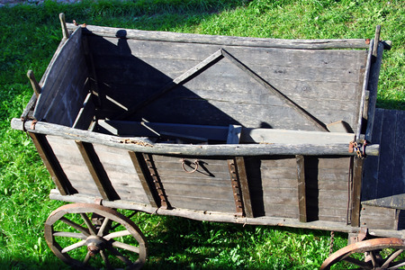 The retro freight cart on the background of the grassの写真素材